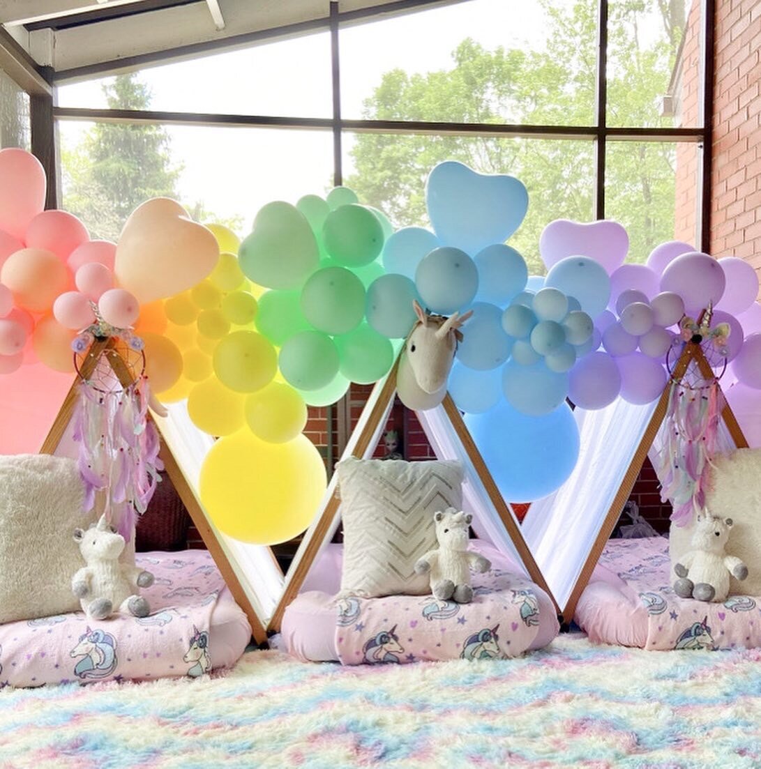 Unicorn rainbow tent set up for girls birthday party