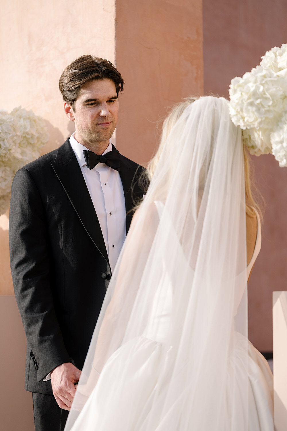 groom looking at bride during wedding ceremony