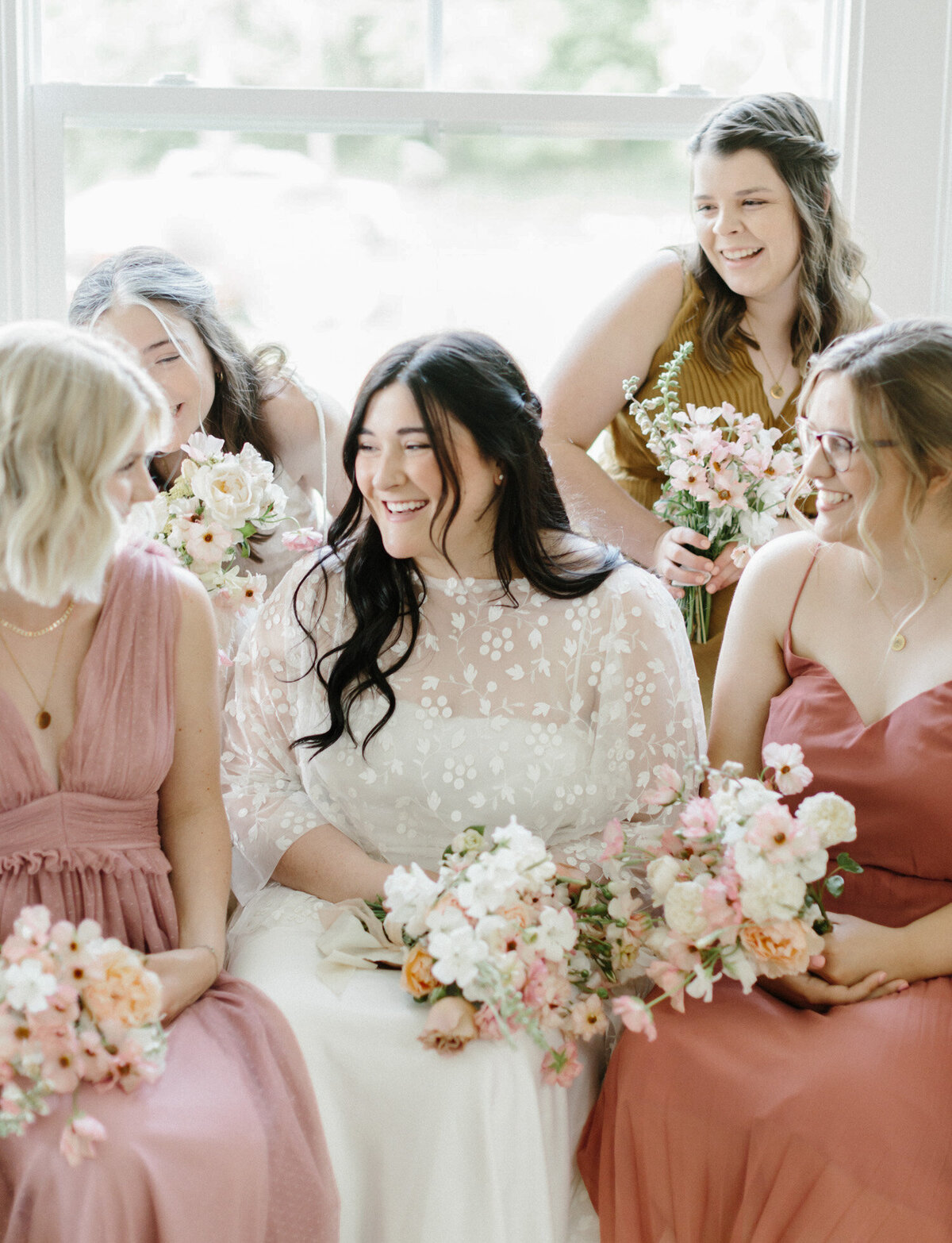 bridesmaids in warm tones at Glass House Community, Michigan