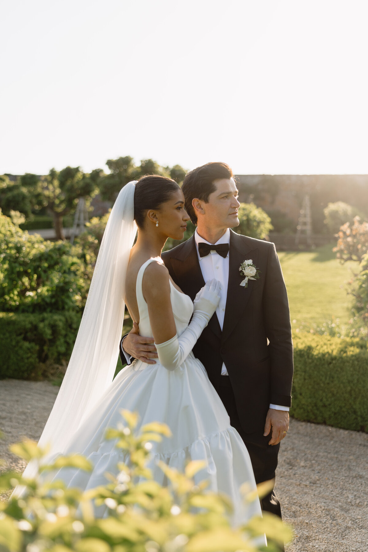 Bride and groom sunset portrait at Babington House, quiet luxury wedding photography UK by The Falkenburgs Studio