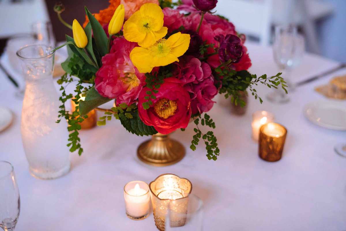 Candlelight softens the bright colors of this cheerful indian wedding.