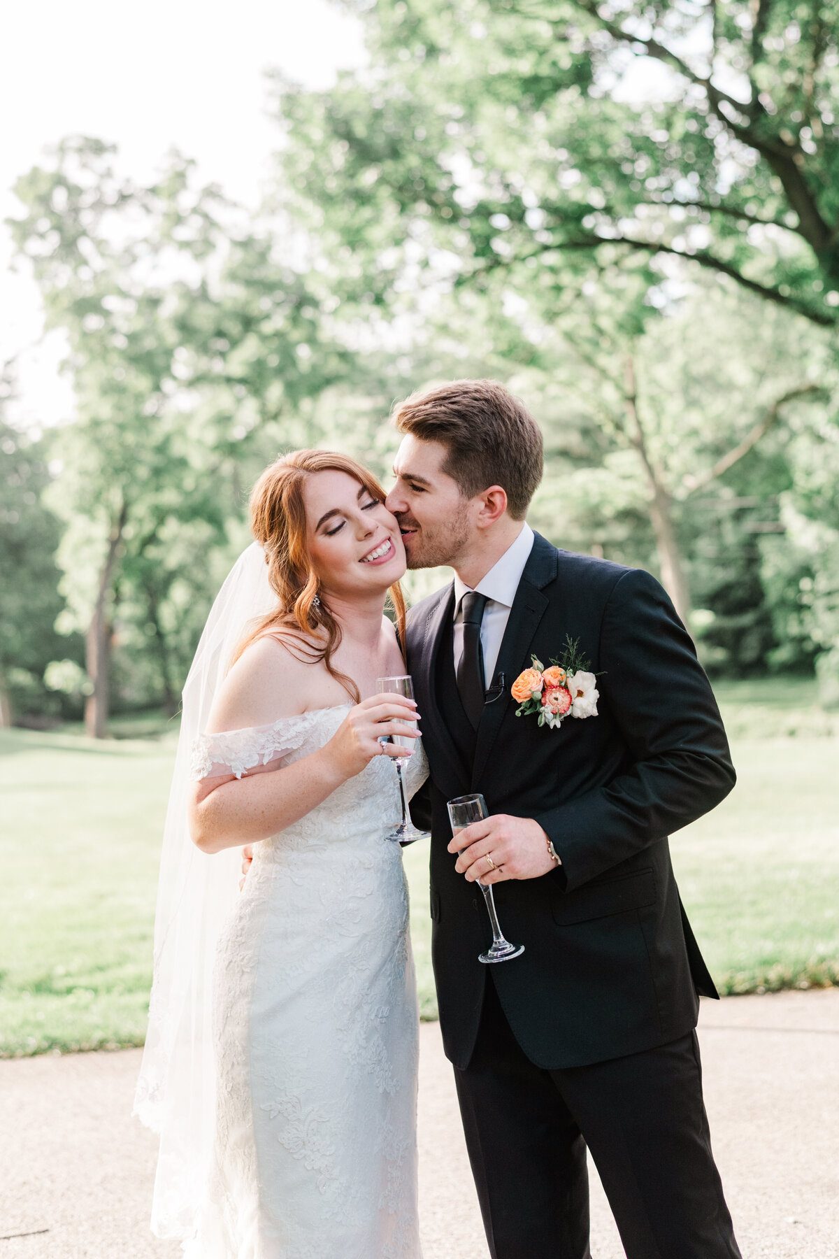 A Bride and groom celebrate with champagne after they are married