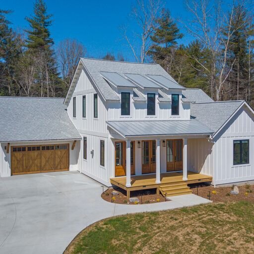 A modern farmhouse with a large front porch in Asheville