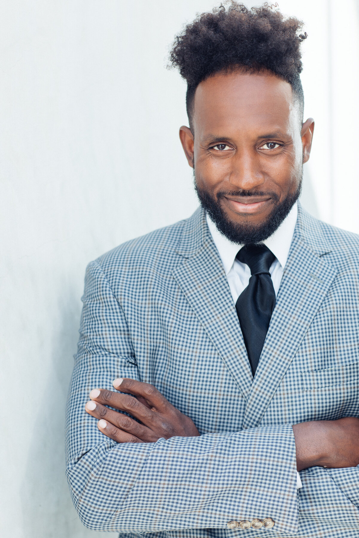 Man Wearing Thin Stripe Suit with Black Necktie Headshot in LA