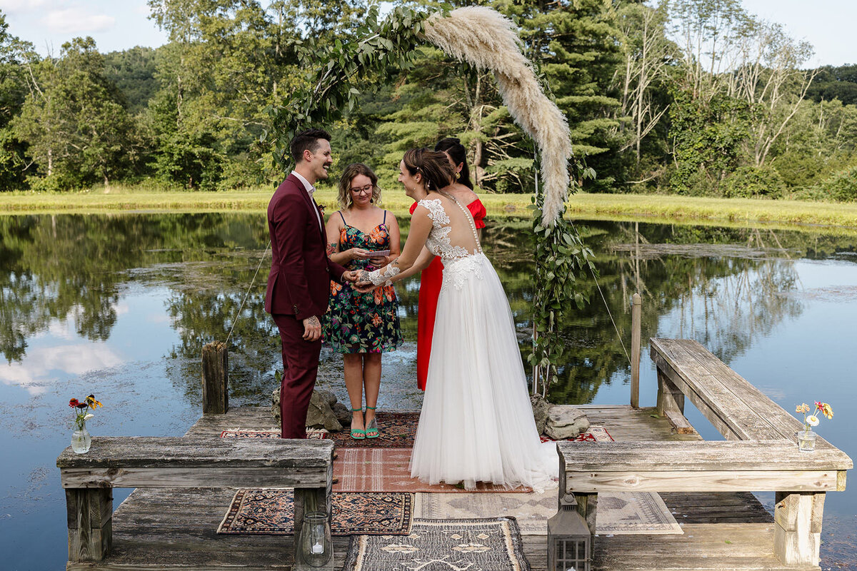 A couple laughing as they say their vows