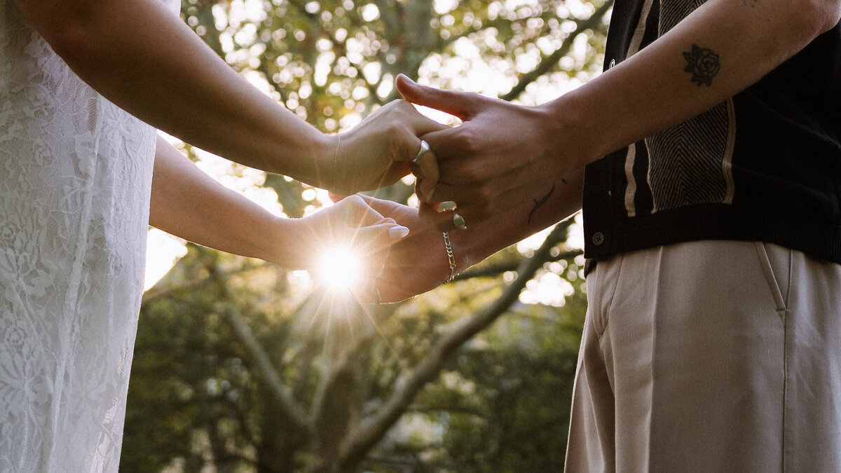 couple holding hands close up