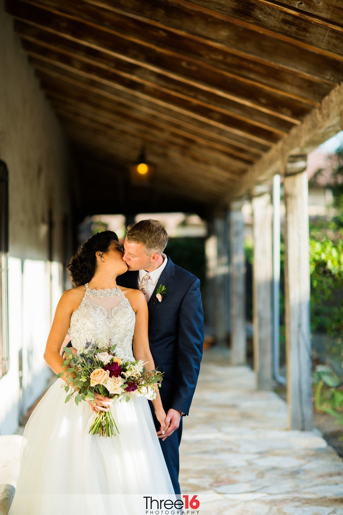 Bride and Groom sharing a kiss