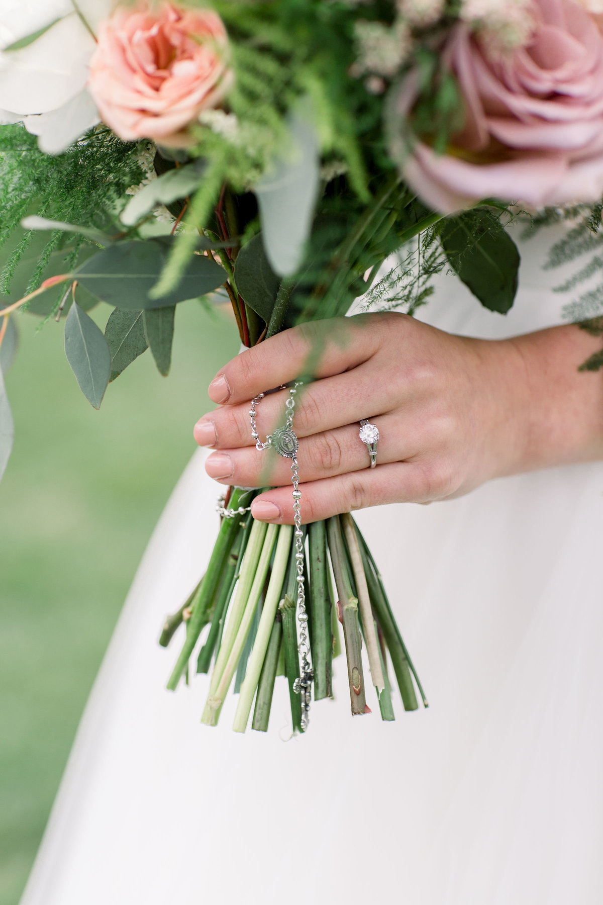 Bride's bouquet and wedding ring at Woodlands Colorado wedding