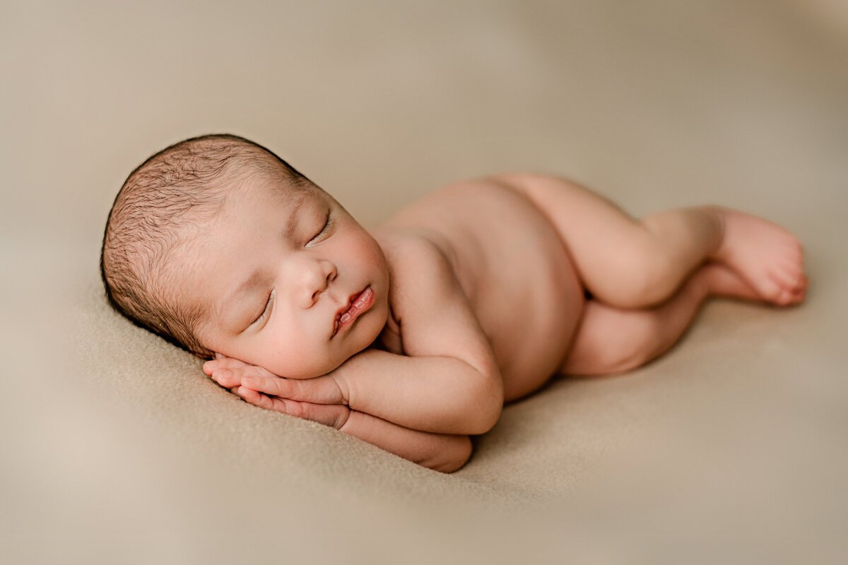 posed newborn session of baby boy in waxhaw studio