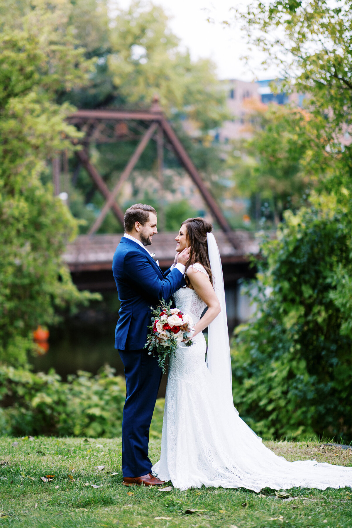 bride and groom  embracing in the park in Minneapolis