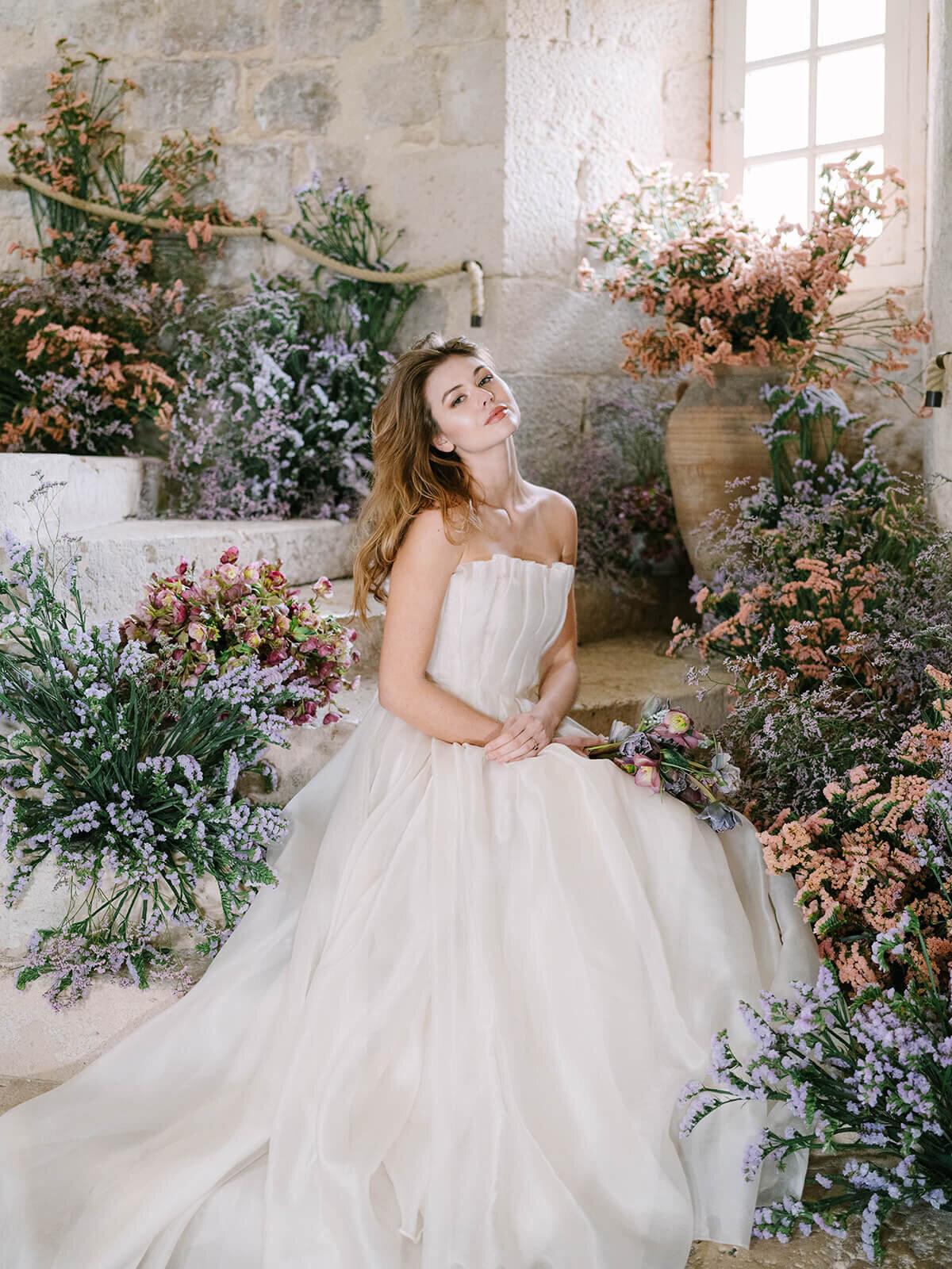 Bride surrounded by colorful florals on her DC wedding