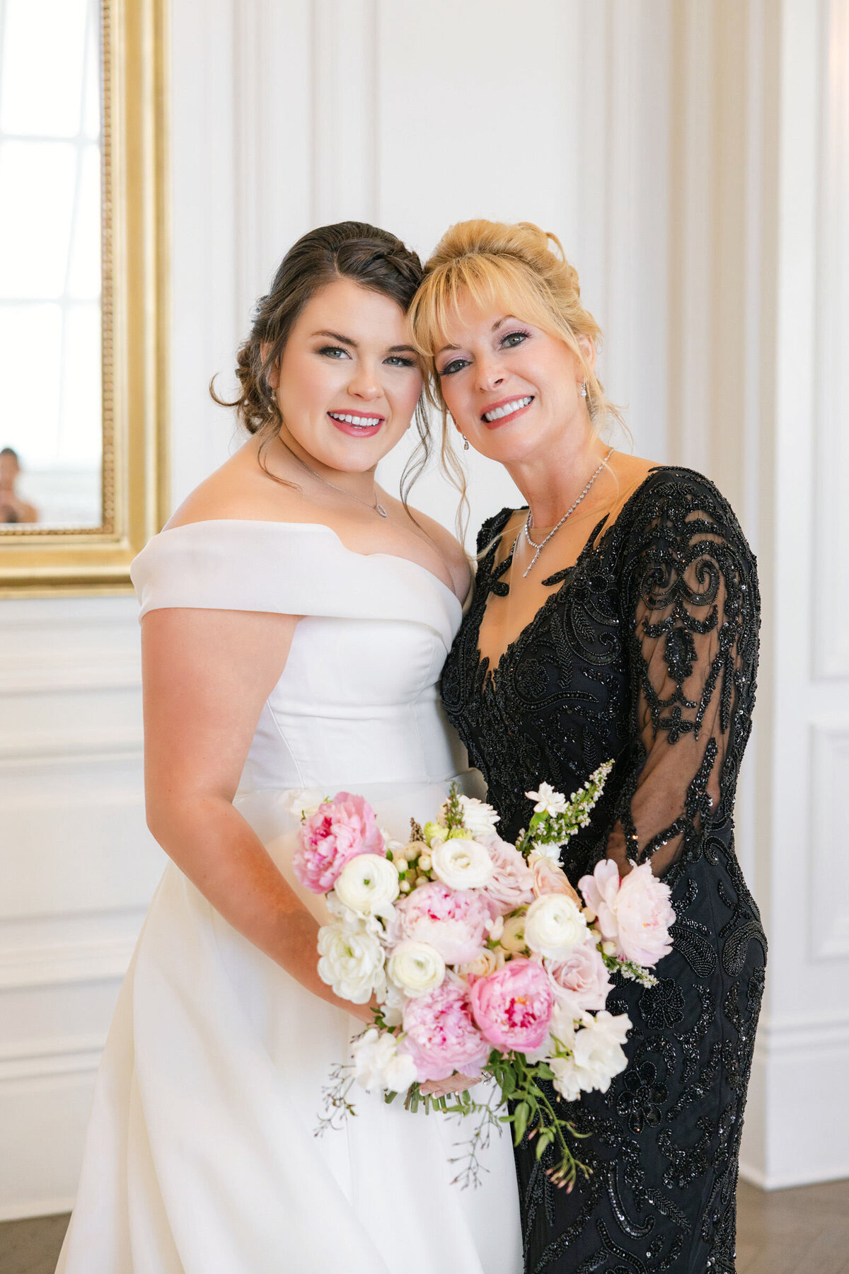 close-up portrait of the bride with her mother in a black lace dress at The Adolphus in Dallas, capturing a heartfelt and elegant wedding moment.