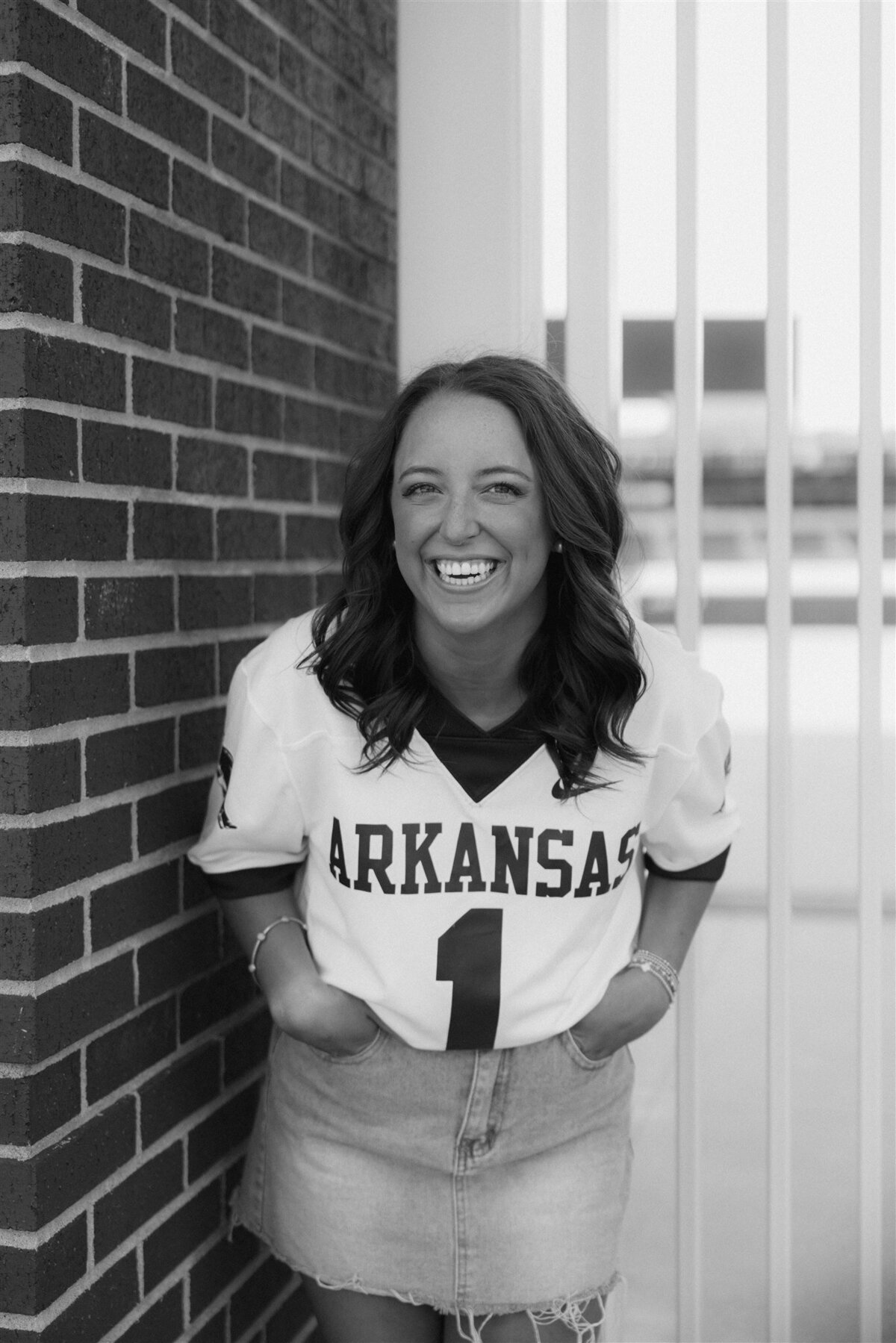 Senior Girl Laughing in Arkansas Football Jersey
