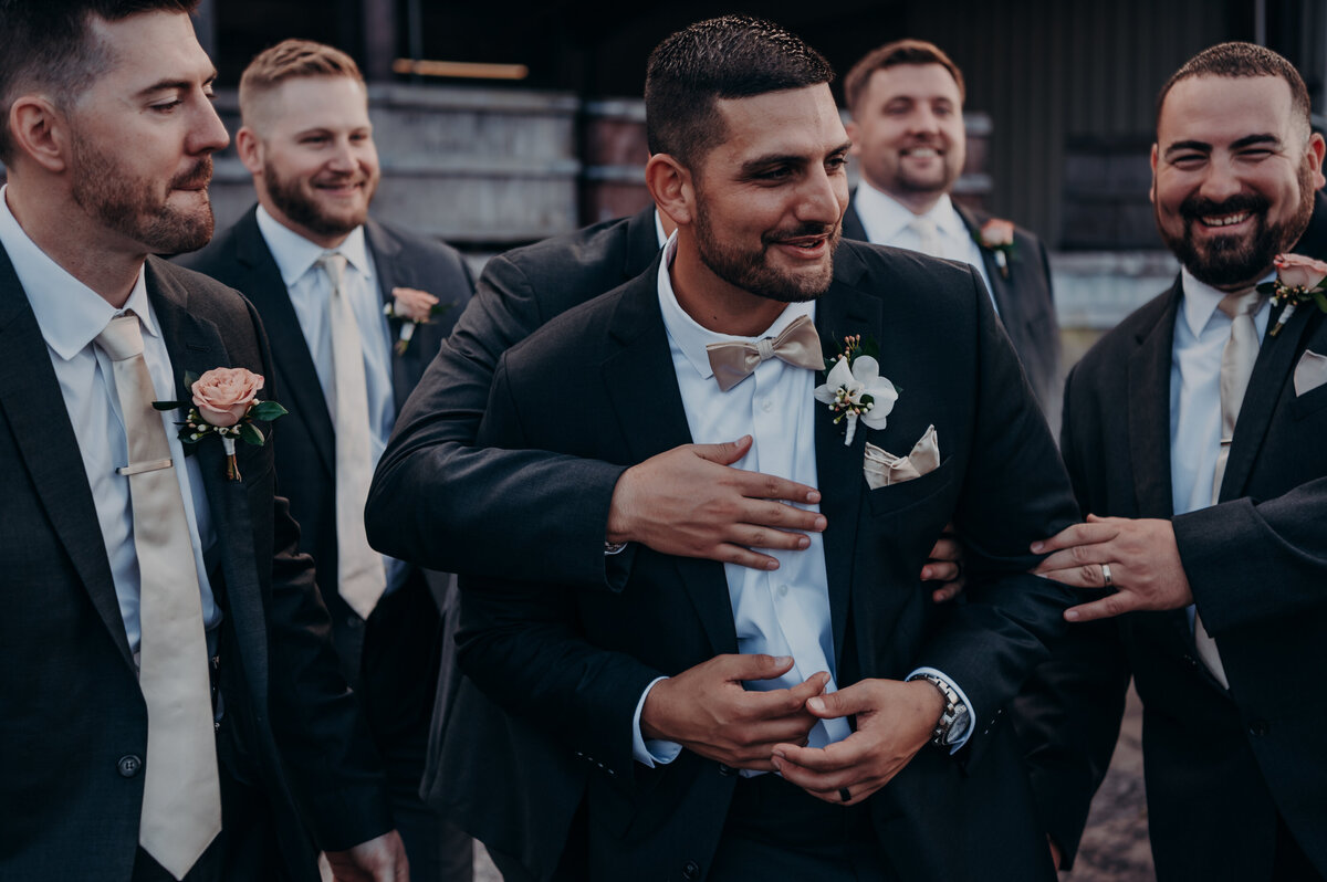 Bradenton wedding photos | sarasota wedding photos | groom photos | groomsman photos | candid groomsman photos - mixon fruit farm wedding