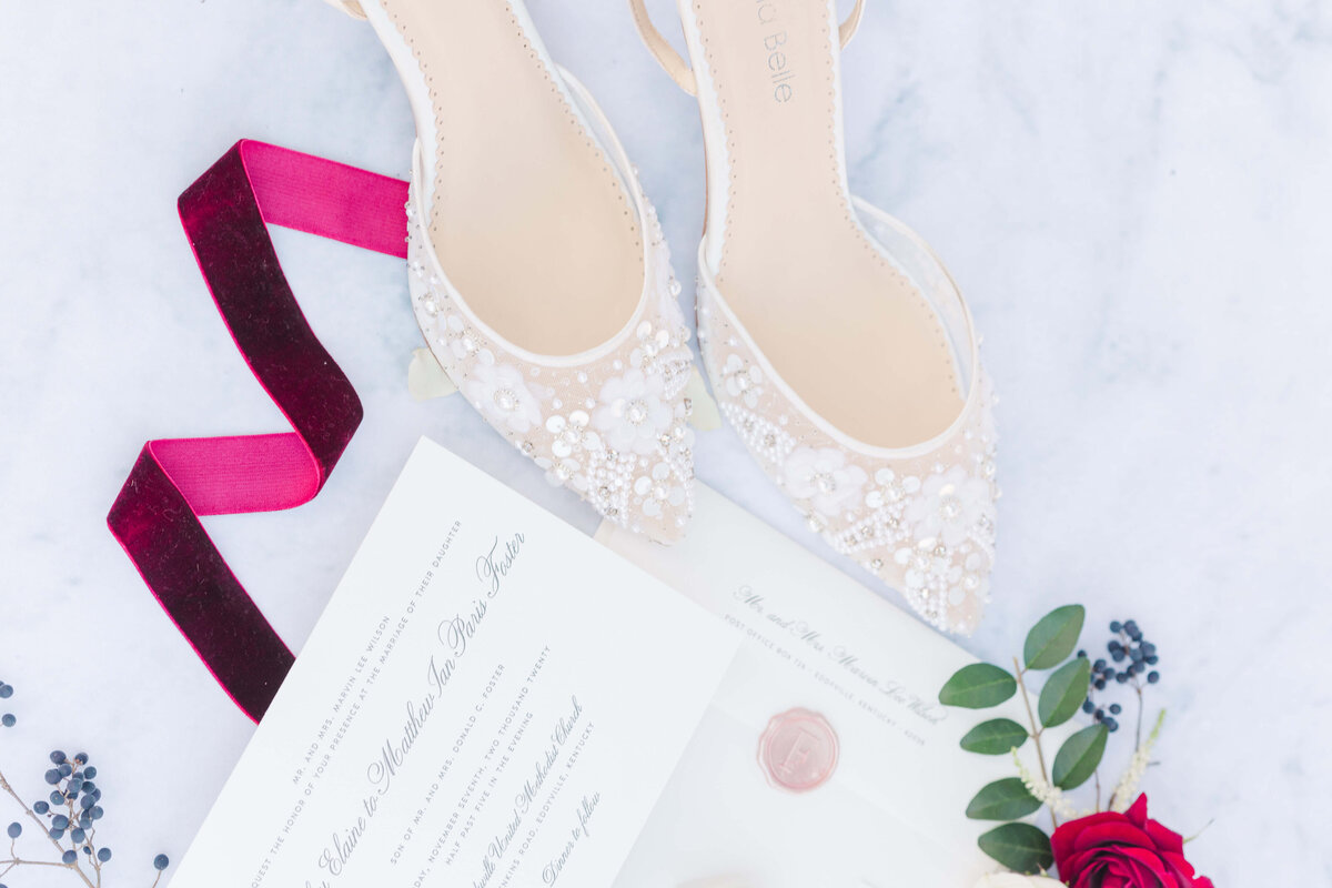 Shoes, invitations, ribbons and florals