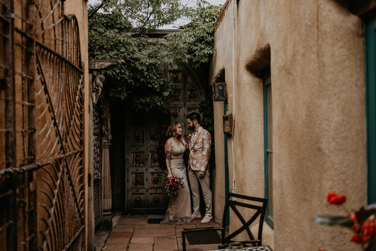 bride and groom standing together in Santa Fe before their ceremony