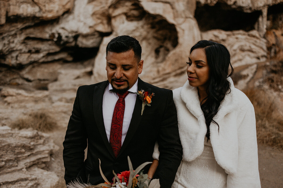 newlyweds walking together at the Soda Dam in Jemez Springs, NM
