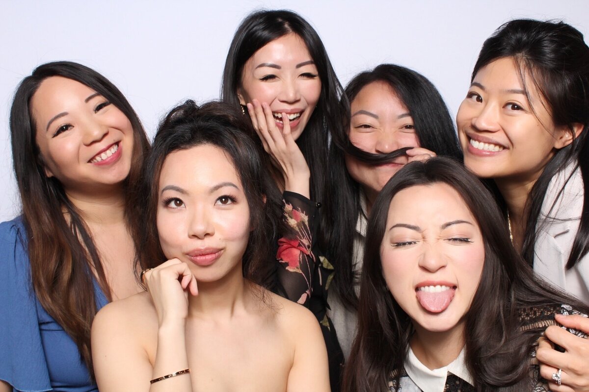 friends-taking-silly-picture-at-wedding-recption