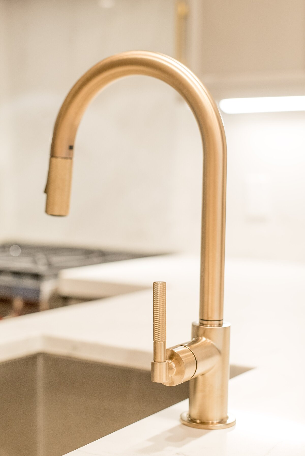 brushed-gold-kitchen-faucet-modern-design-comm-ave-min