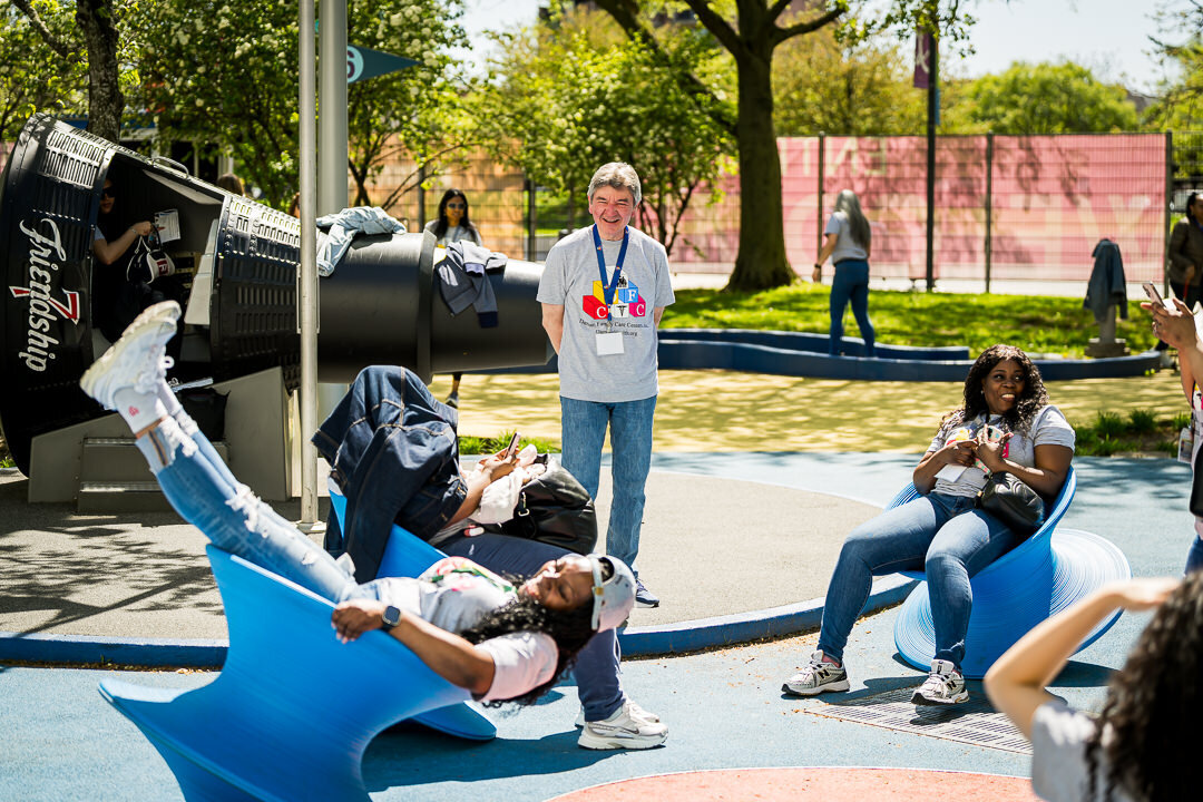 Corporate event photography of professionals seated outdoors participating in team activity session new jersey.
