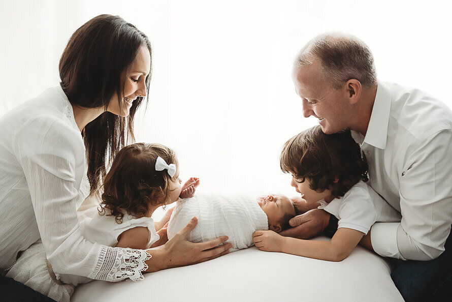 Family sends down to look at new baby.