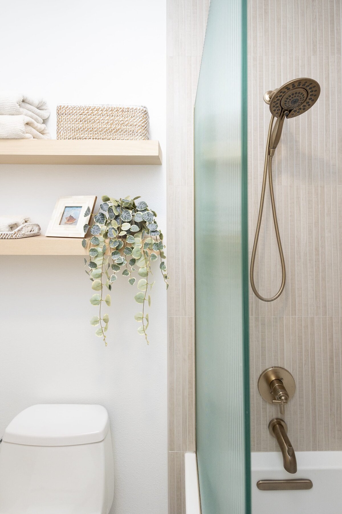 dewine design orlando interior designer contemporary coastal teen bathroom shower with bronze faucet and shower head