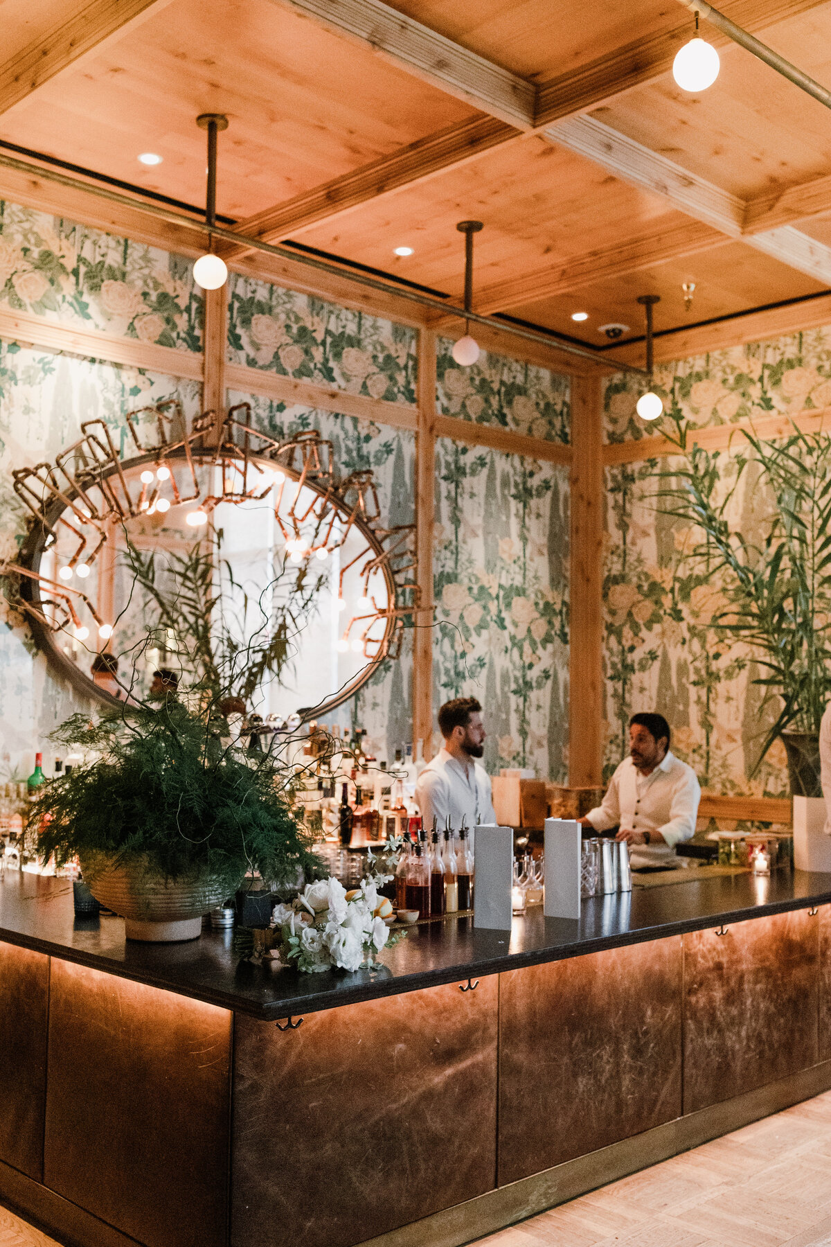 Bar tenders behind the bar at The Proper Hotel Austin