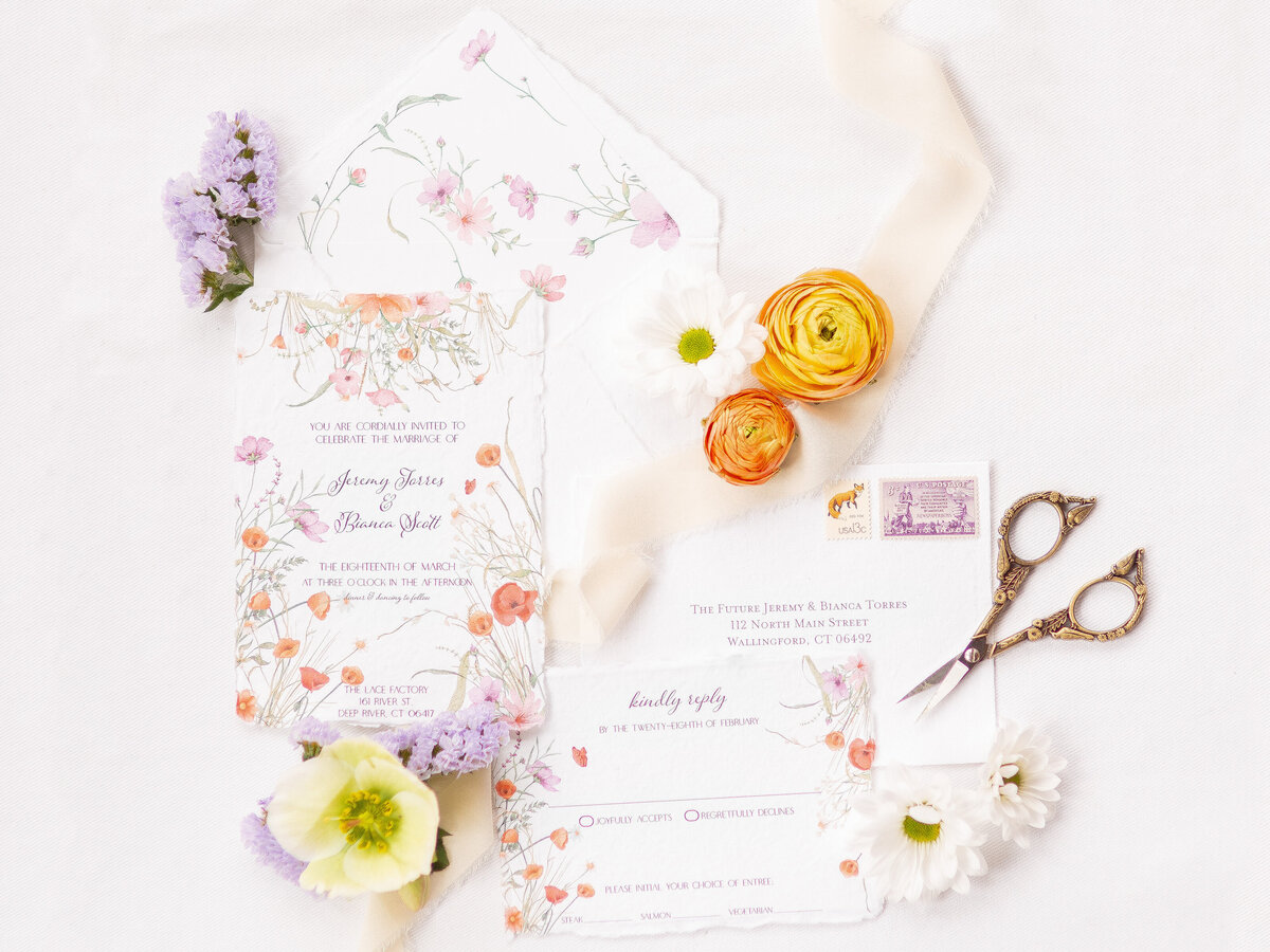 Wedding invitation flat lay with flowers
