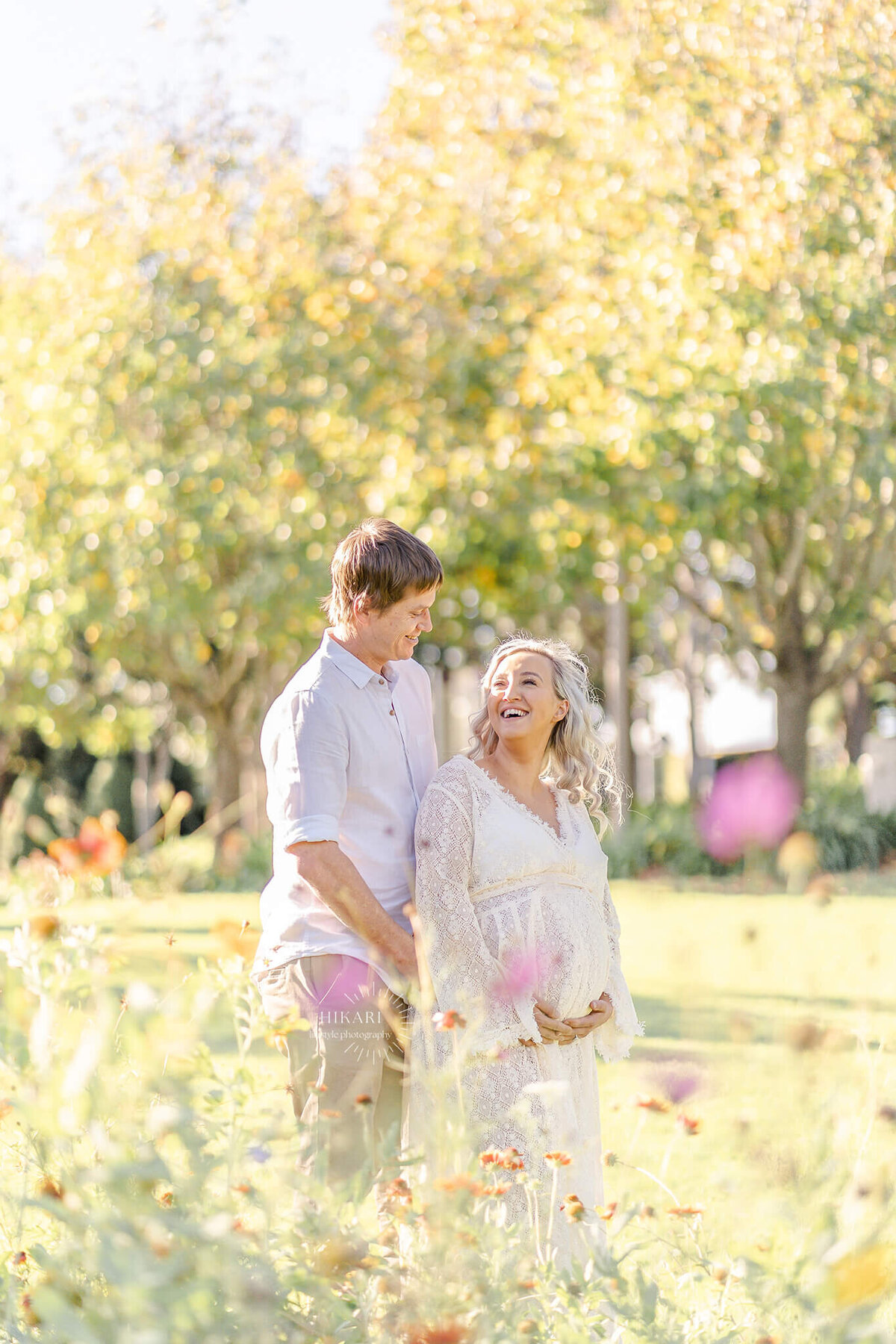light and airy photos in flower field near gold coast during couples maternity photography.