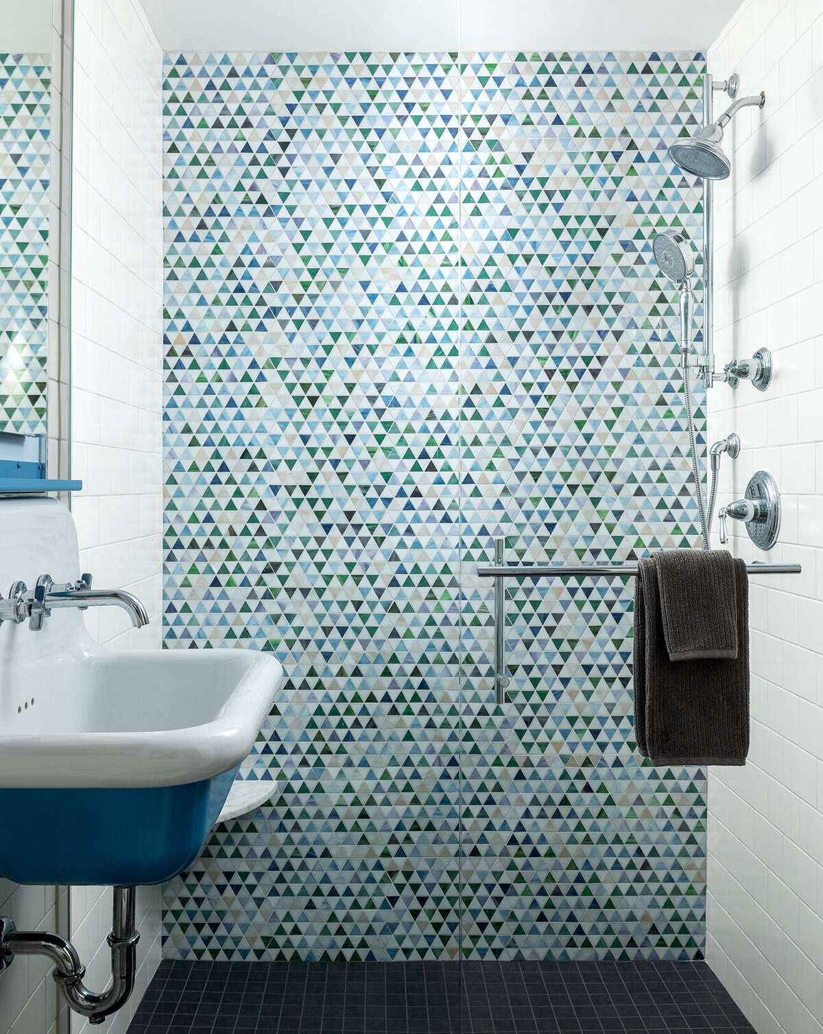 shower room with blue tiles and blue accent sink