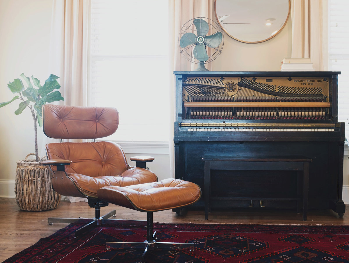 Canva - Chair and Piano in the Living Room