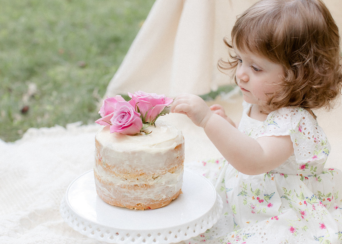 baby-touching-flower-cake
