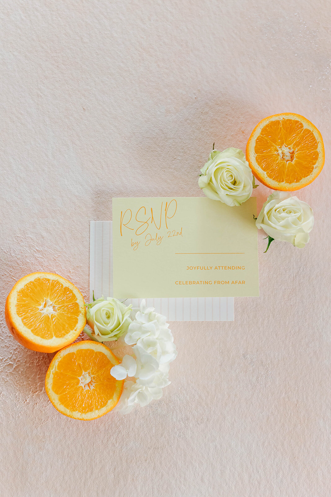 rsvp-card-flatlay-with-orange-and-flowers