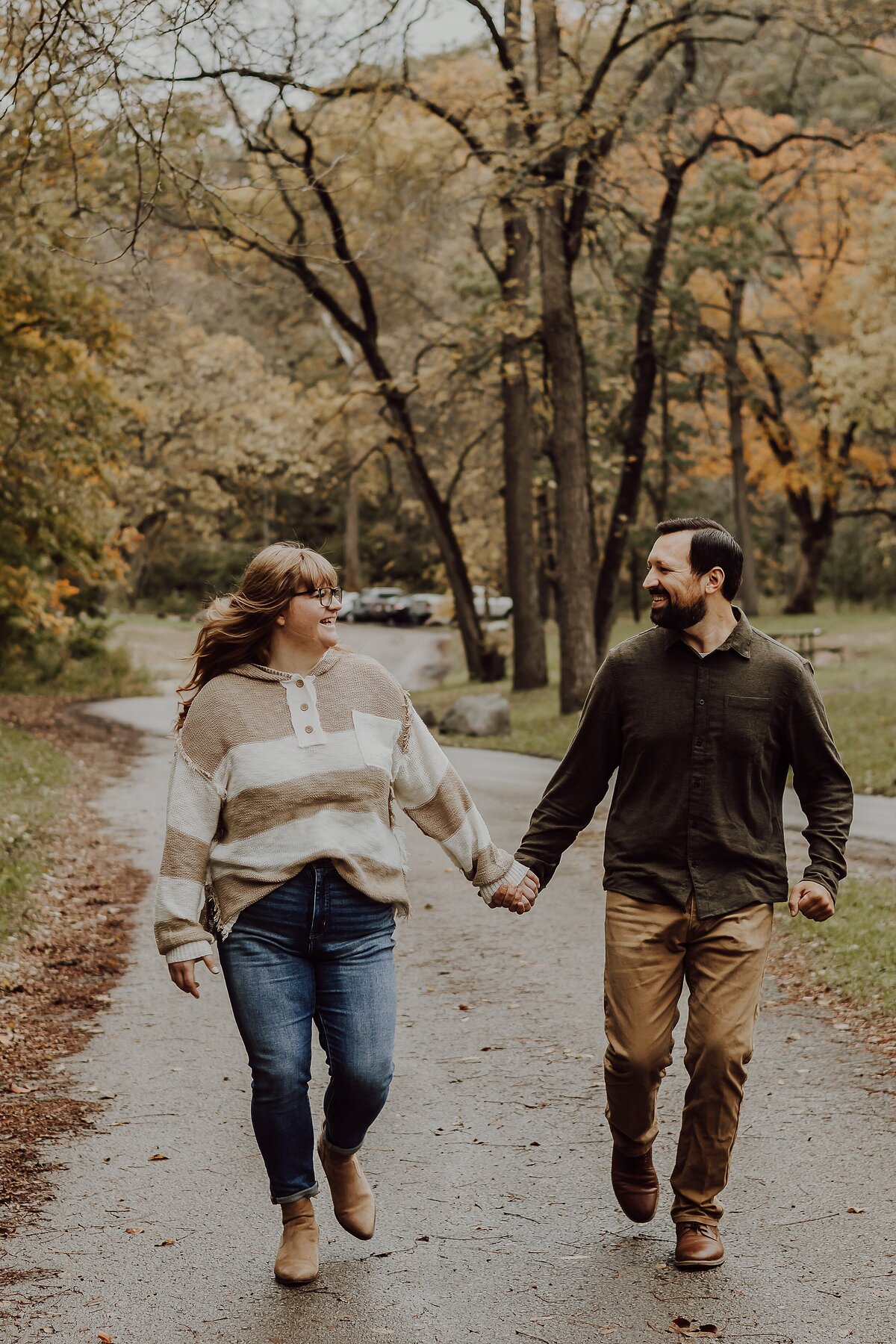 midwest-couple-walking-fall-session-ledges-state-park-madrid-iowa-storyteller-collective-photo-co