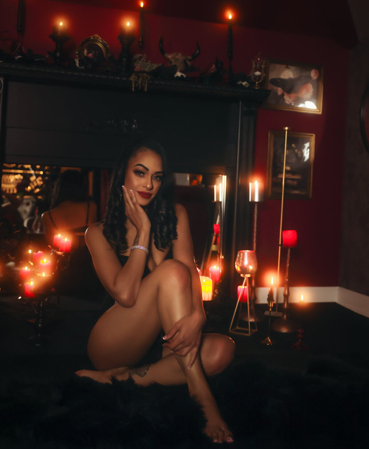 Savannah Boudoir Brunette in red room with candles