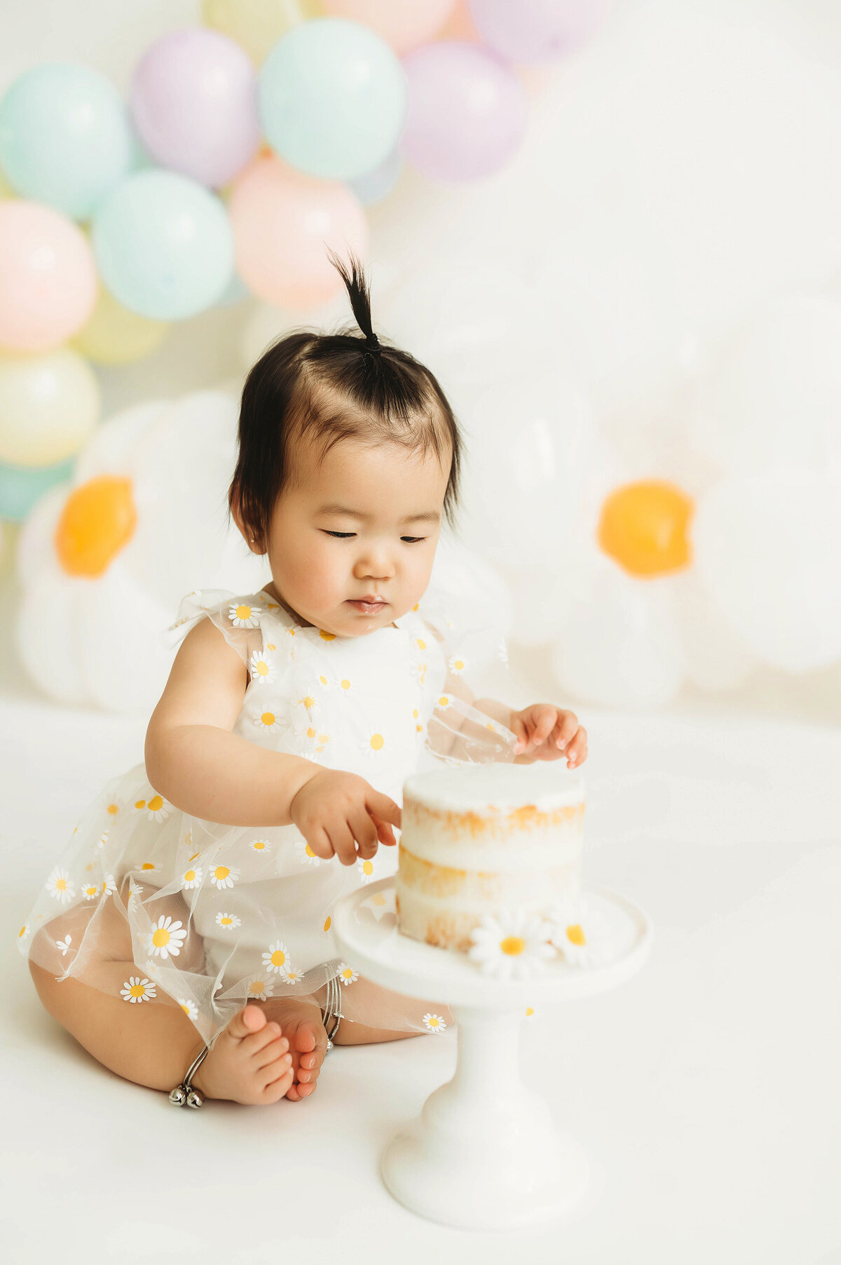 Baby enjoys Cake Smash Photoshoot in Asheville, NC.