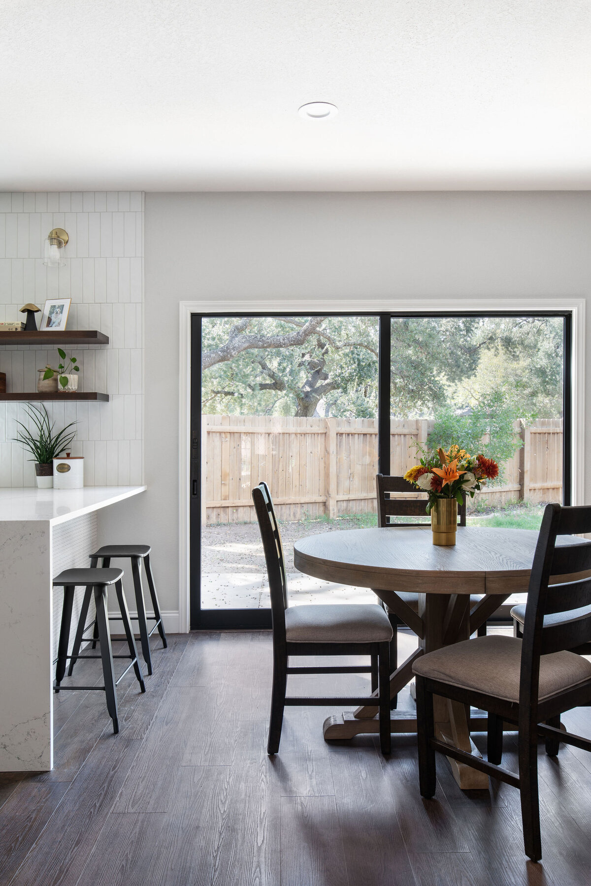 hello-home-austin-waterfall-peninsula-kitchen-remodel-countertop-window-tile-to-ceiling-2