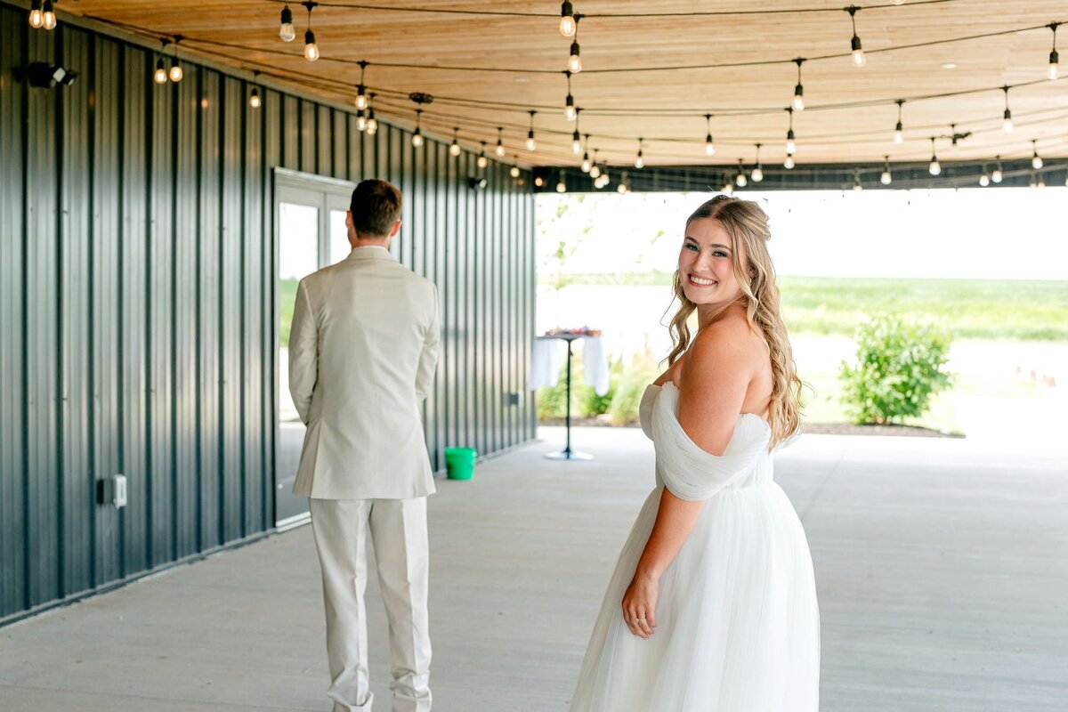 bride-approaching-groom-first-look