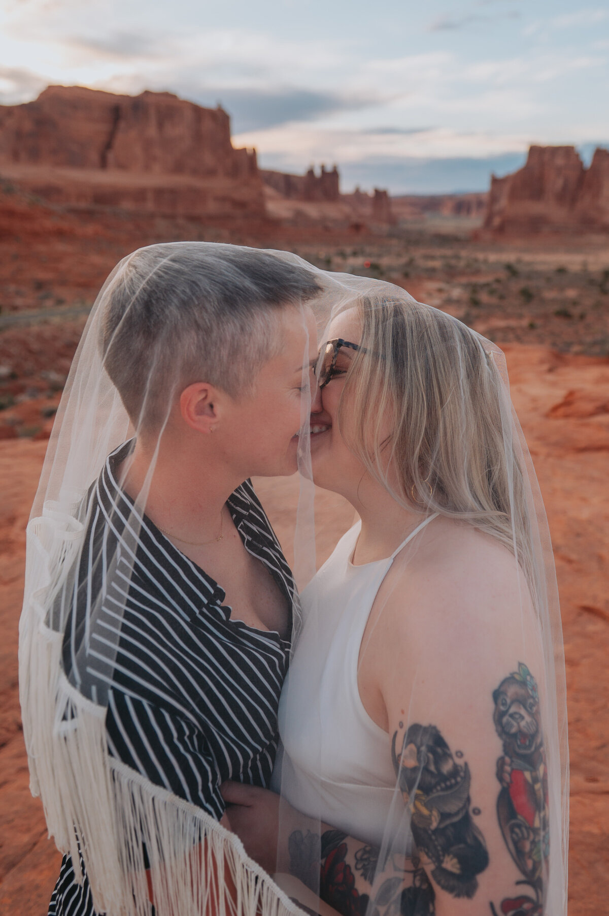 Newlyweds lean in for a kiss