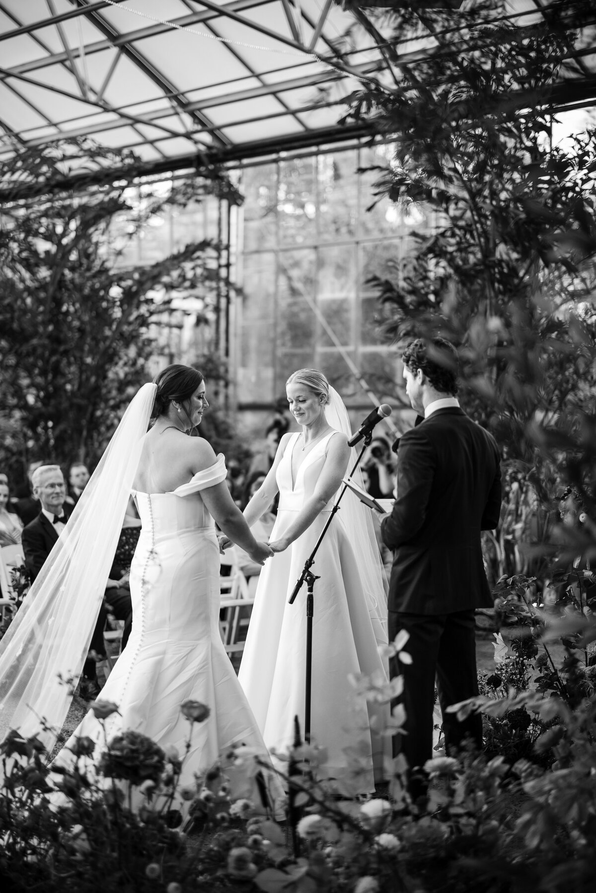 A black and white photo of a ceremony at a  Fairmount Park Horticulture Center wedding