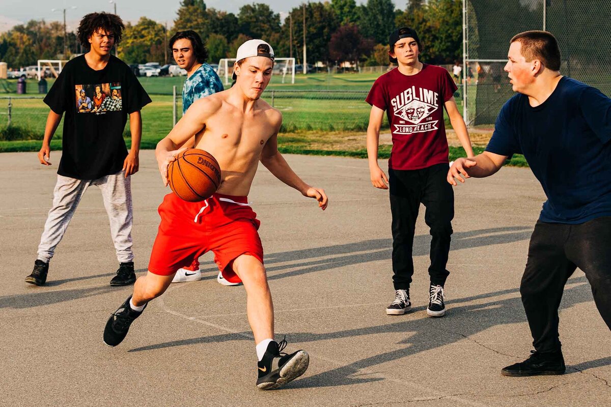 Missoula youth playing basketball at Playfair Park