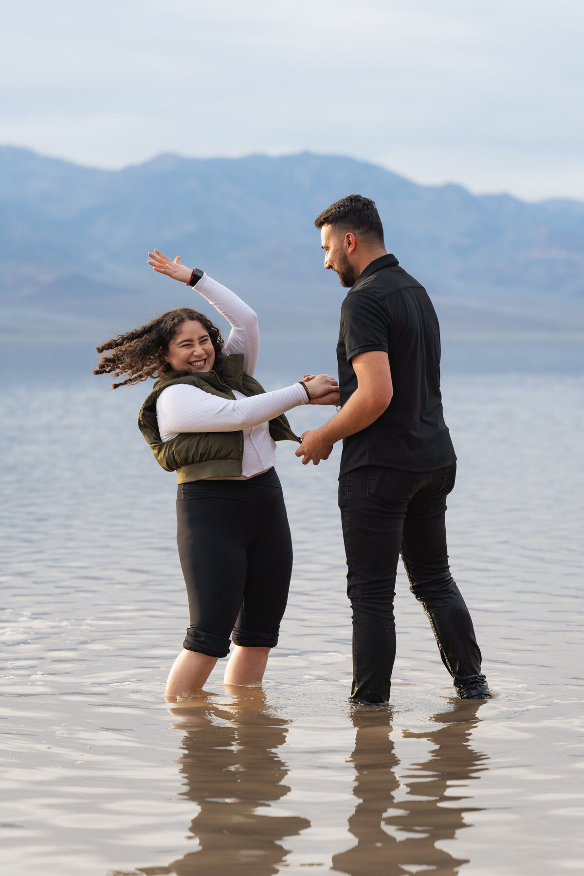 A person celebrating right after their partner proposed