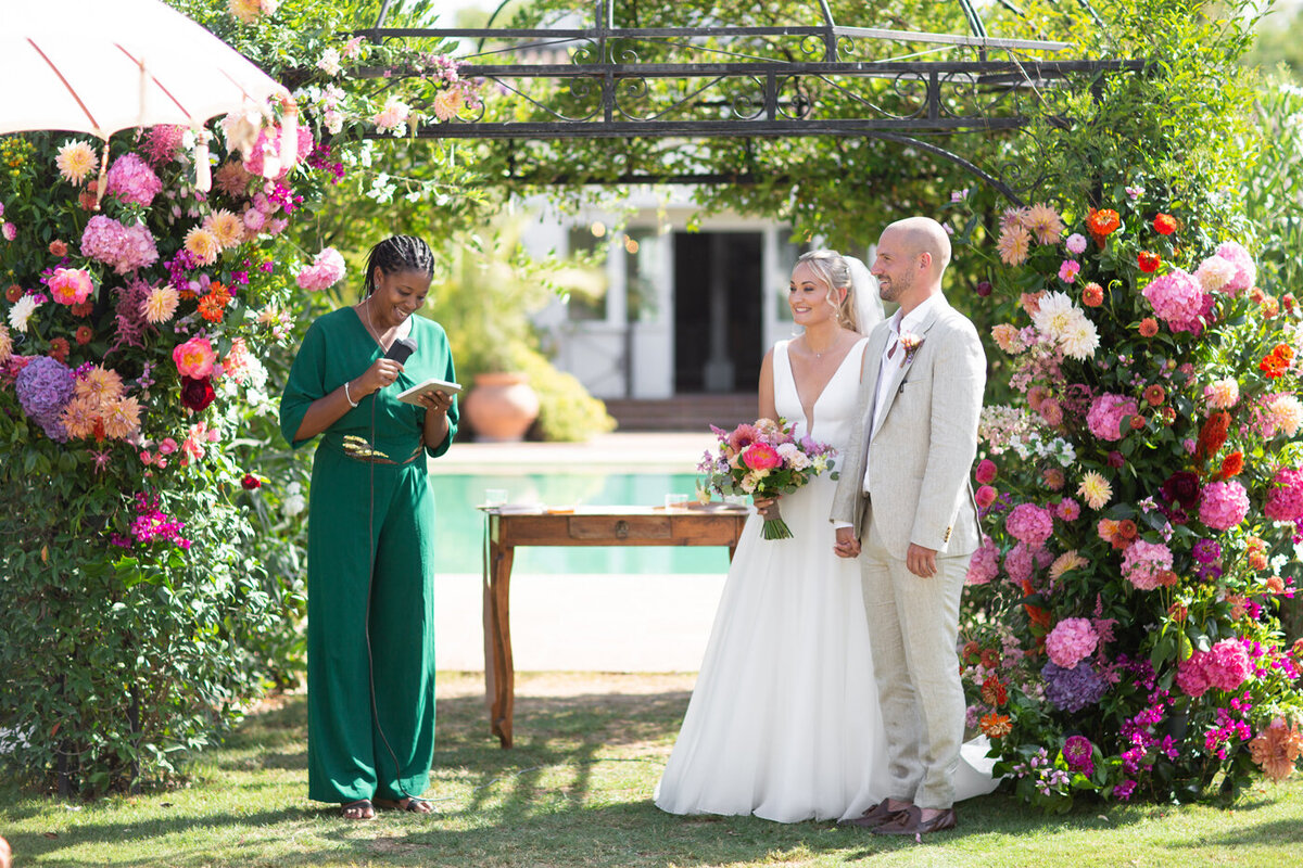 Wedding ceremony with bright wedding flowers