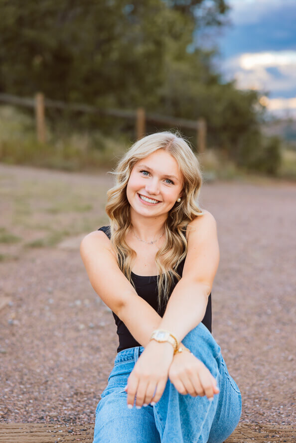 Girl crosses arm on a trail in Denver, Colorado.