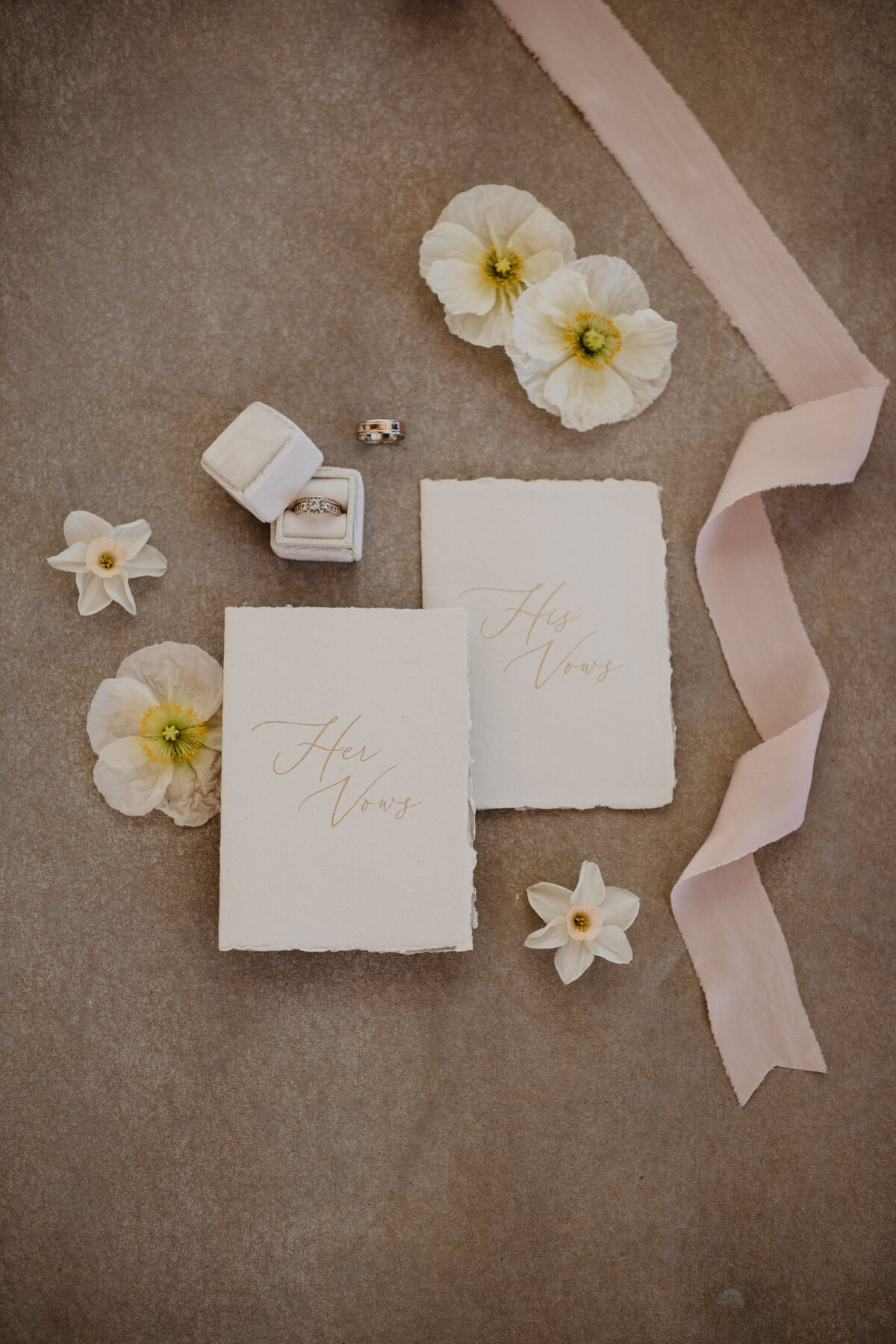 Utah Elopement Photographer captures wedding details with vow books and ribbon