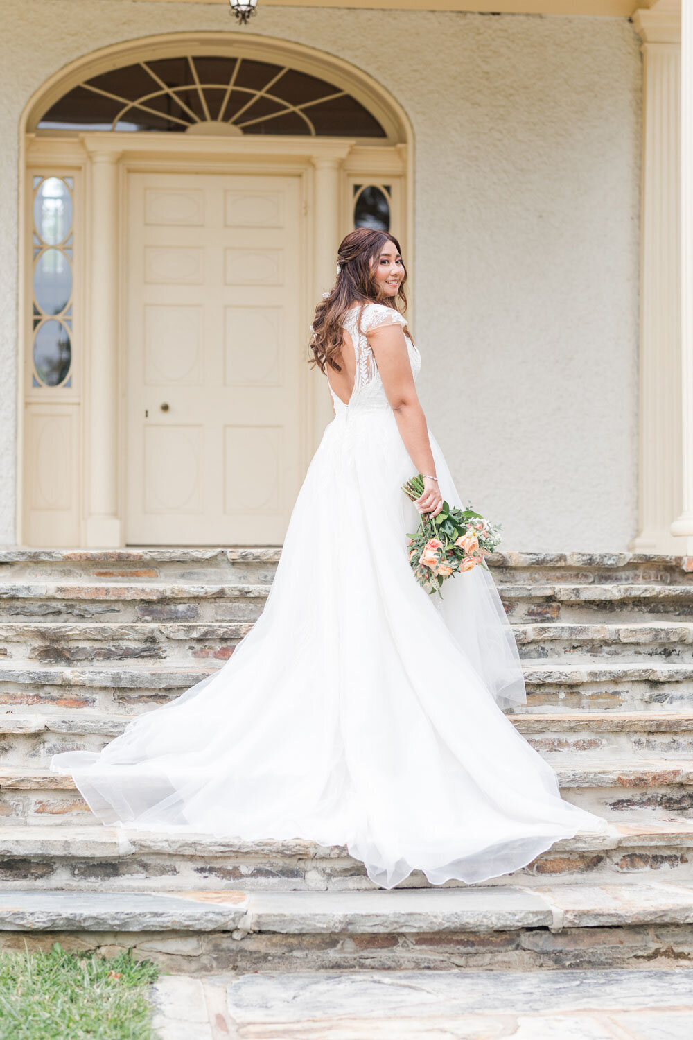 Back pose of a bride in the stairs
