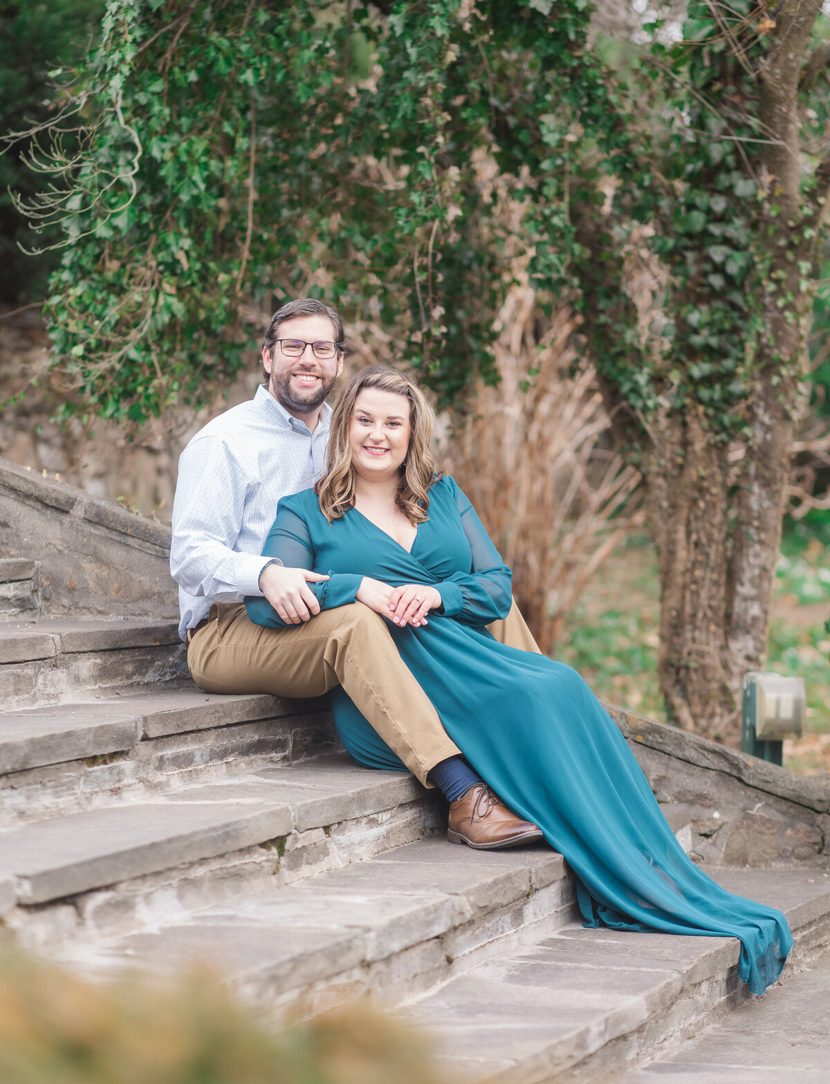 couple all dressed up on the steps of box hill in york pa for engagement photo's