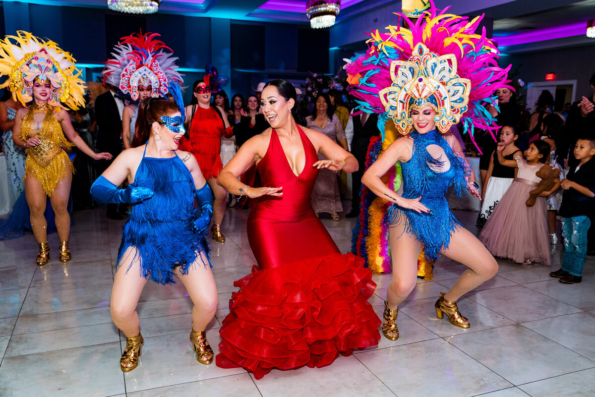 Three girls dancing on dance floor during reception