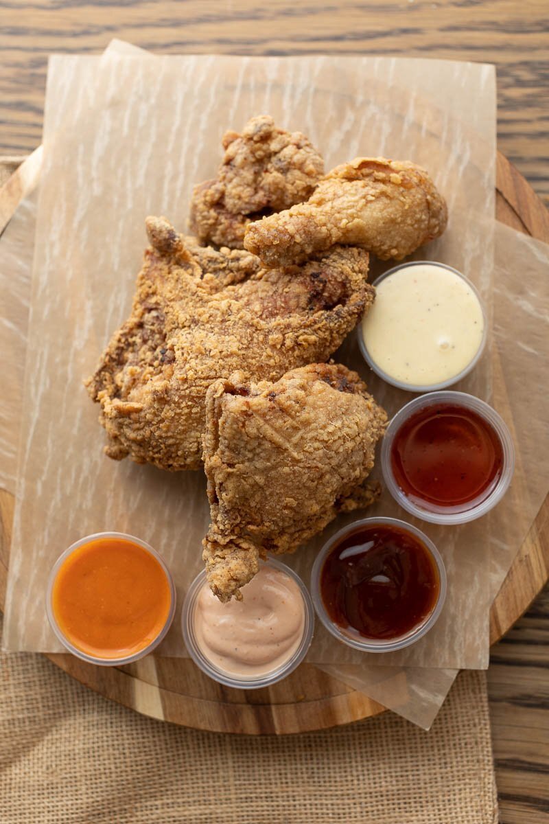 Fried Chicken surrounded by colorful sauces