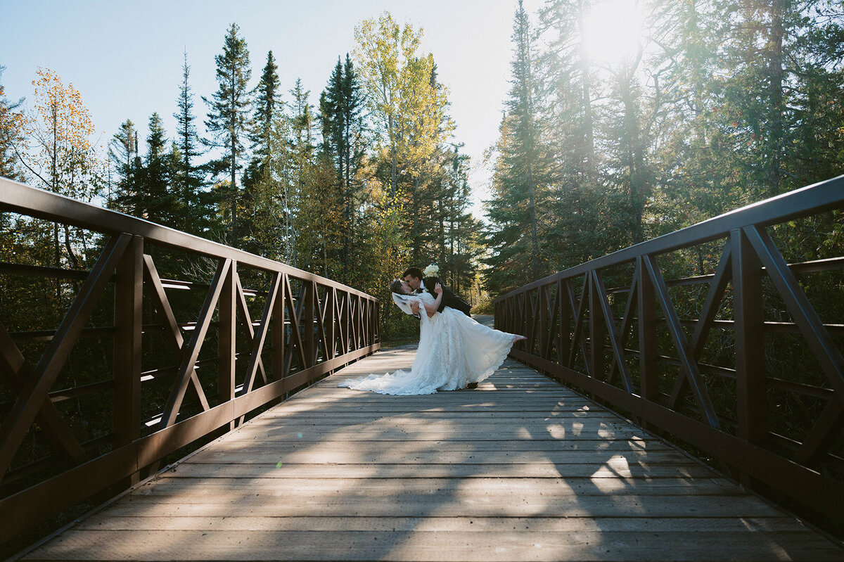 couple kissing on the bridge